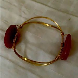 Gold plated bangle w/red accent stones